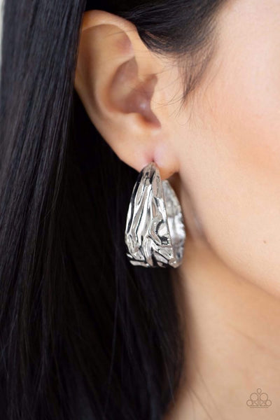 BADLANDS AND BELLBOTTOMS - SILVER WARPED HOOP EARRINGS - PAPARAZZI