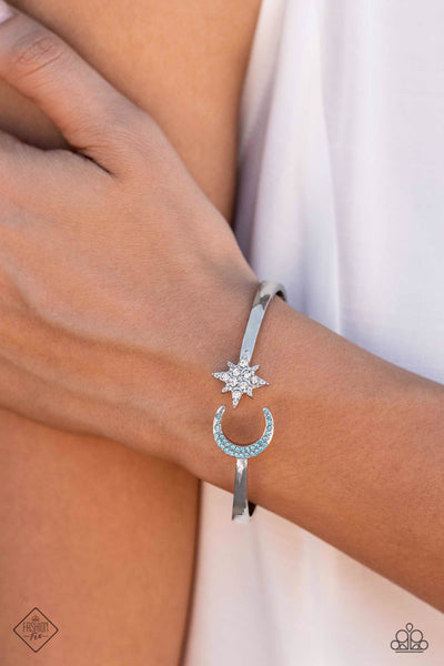 ASTRAL ARRANGEMENT - BLUE RHINESTONE SILVER MOON AND STAR HINGED BRACELET - PAPARAZZI - FASHION FIX AUGUST 2023