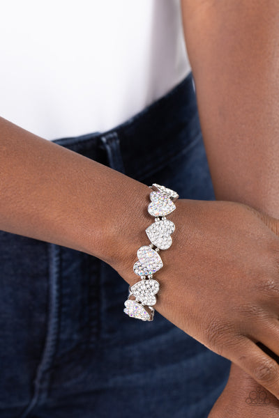 HEADLINER HEART - WHITE PINK IRIDESCENT RHINESTONE SILVER HEART STRETCHY BRACELET - PAPARAZZI