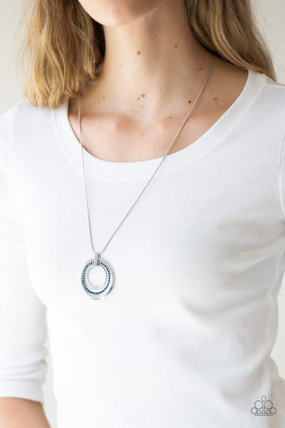 GATHER AROUND GORGEOUS - BLUE RHINESTONE SILVER CIRCLE PENDANT NECKLACE - PAPARAZZI