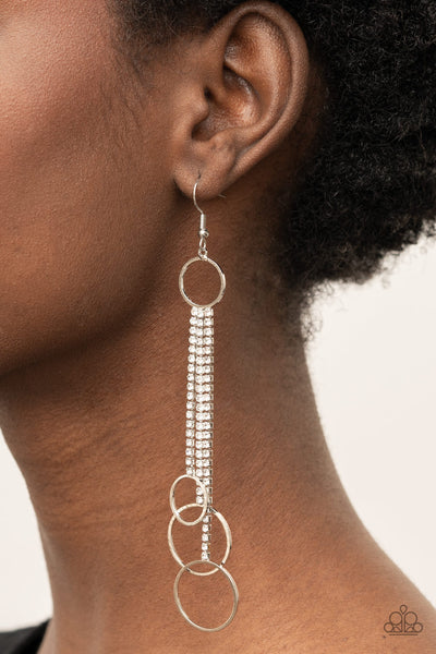 DEMURELY DAZZLING - WHITE RHINESTONE SILVER DANGLE CIRCLE EARRINGS - PAPARAZZI
