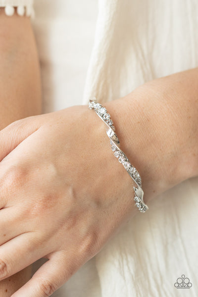 TWISTED TWINKLE - WHITE RHINESTONE TWISTED SILVER BAR CUFF BRACELET - PAPARAZZI