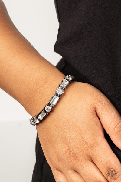 CLASSIC COUTURE - BLACK GUNMETAL FRAME WHITE RHINESTONE STRETCHY BRACELET - PAPARAZZI