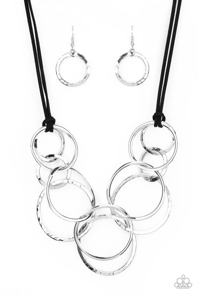 SPIRALING OUT OF COUTURE - SILVER CIRCLE BLACK LEATHER CORD NECKLACE - PAPARAZZI