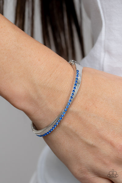 PALACE PENTHOUSE - BLUE RHINESTONE SILVER HINGED BRACELET - PAPARAZZI