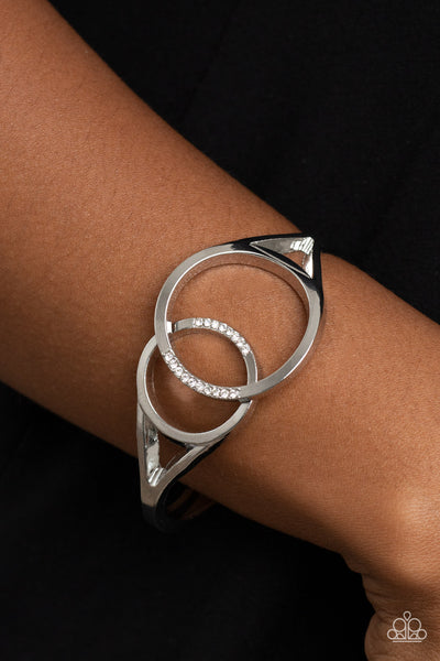 SCOPE OF EXPERTISE - WHITE RHINESTONE SILVER CIRCLE HINGED BRACELET - PAPARAZZI