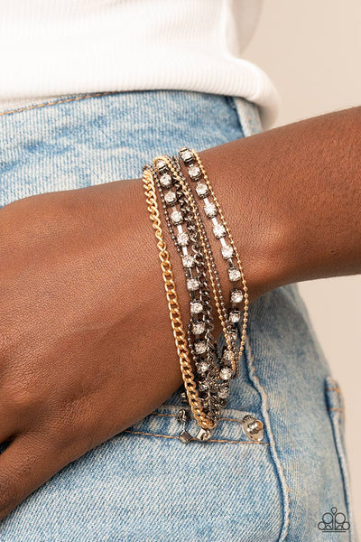 SECRETLY SASSY - MULTI GUNMETAL AND GOLD RHINESTONE BRACELET - PAPARAZZI