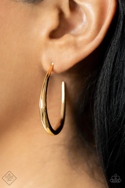 CURVE YOUR APPETITE - GOLD ASYMMETRICAL HOOP EARRINGS - PAPARAZZI FASHION FIX JUNE 2022