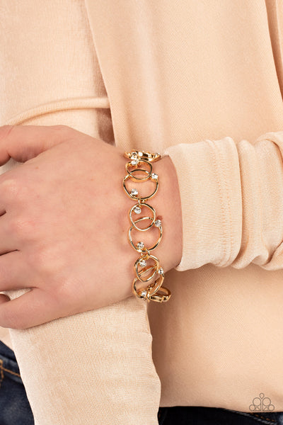 THE UNIVERSE REVOLVES AROUND ME - GOLD CIRCLE WHITE RHINESTONE BRACELET - PAPARAZZI