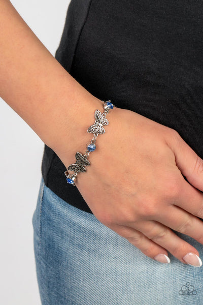 HAS A WING TO IT - BLUE RHINESTONE SILVER BUTTERFLY BRACELET - PAPARAZZI