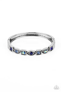 POETICALLY PICTURESQUE - BLUE AND IRIDESCENT RHINESTONE SILVER HINGED BRACELET - PAPARAZZI