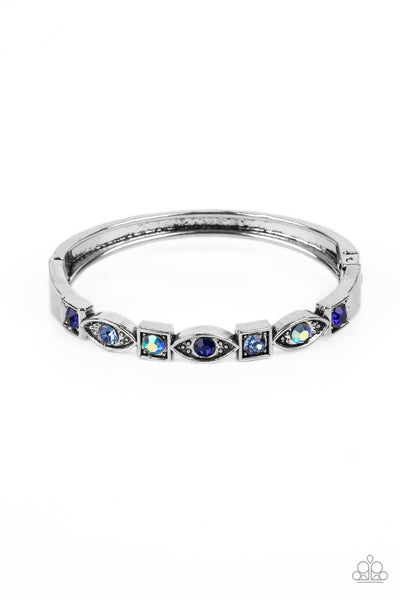 POETICALLY PICTURESQUE - BLUE AND IRIDESCENT RHINESTONE SILVER HINGED BRACELET - PAPARAZZI