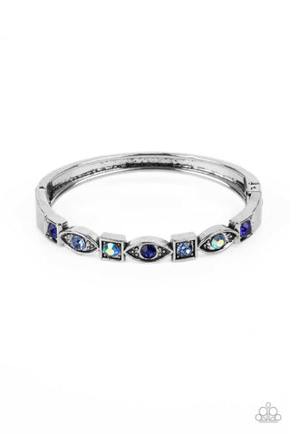POETICALLY PICTURESQUE - BLUE AND IRIDESCENT RHINESTONE SILVER HINGED BRACELET - PAPARAZZI