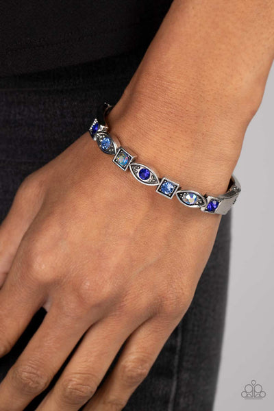 POETICALLY PICTURESQUE - BLUE AND IRIDESCENT RHINESTONE SILVER HINGED BRACELET - PAPARAZZI