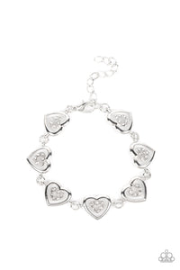 CATCHING FEELINGS - WHITE RHINESTONE SILVER HEART BRACELET - PAPARAZZI