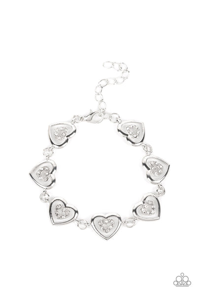 CATCHING FEELINGS - WHITE RHINESTONE SILVER HEART BRACELET - PAPARAZZI