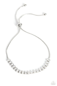 DYNAMIC DIAMONDS - WHITE RHINESTONE SILVER SLIDE BRACELET - PAPARAZZI