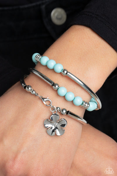 OFF THE WRAP - BLUE BEAD SILVER FLOWER COIL BRACELET - PAPARAZZI