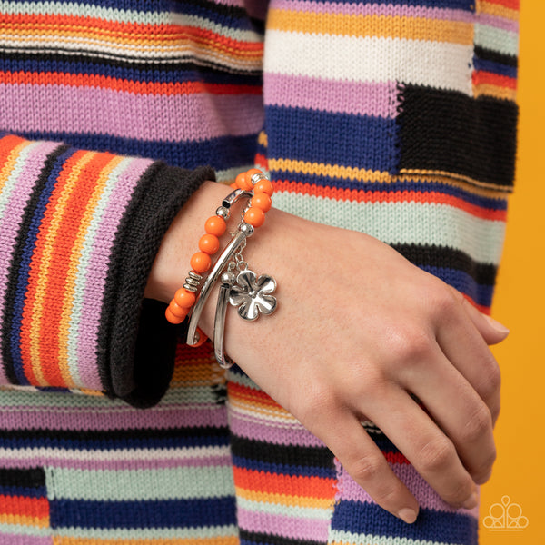 OFF THE WRAP - ORANGE BEAD SILVER FLOWER COIL BRACELET - PAPARAZZI