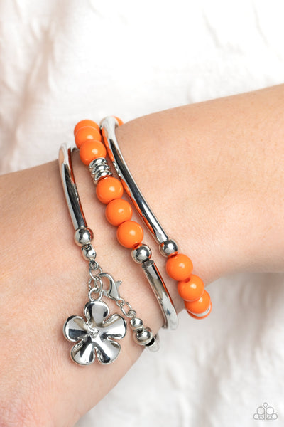 OFF THE WRAP - ORANGE BEAD SILVER FLOWER COIL BRACELET - PAPARAZZI