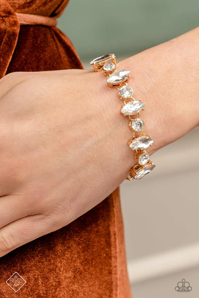 EXCLUSIVELY EXTRAVAGANT - GOLD WITH WHITE RHINESTONE BRACELET - PAPARAZZI - FASHION FIX MARCH 2023