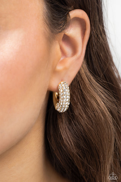 COMBUSTIBLE CONFIDENCE - GOLD WHITE RHINESTONE HINGED HOOP EARRINGS - PAPARAZZI