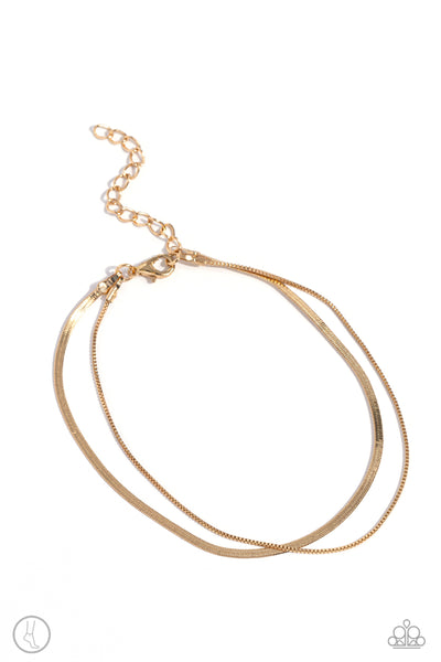 GLISTENING GAUGE - GOLD LAYERED ANKLET - PAPARAZZI