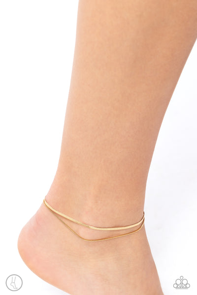 GLISTENING GAUGE - GOLD LAYERED ANKLET - PAPARAZZI