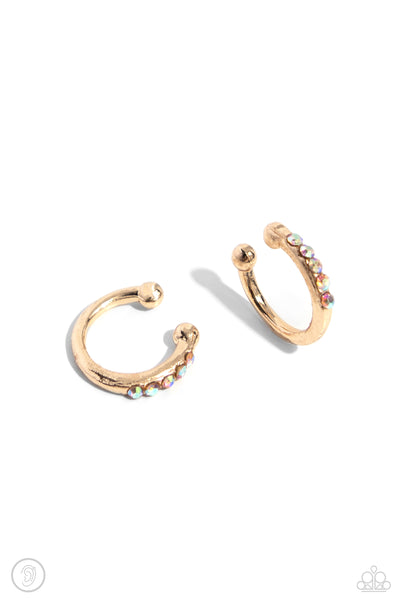CHARMING CUFF - GOLD IRIDESCENT RHINESTONE EAR CUFF EARRINGS - PAPARAZZI