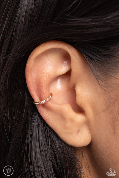 CHARMING CUFF - GOLD IRIDESCENT RHINESTONE EAR CUFF EARRINGS - PAPARAZZI