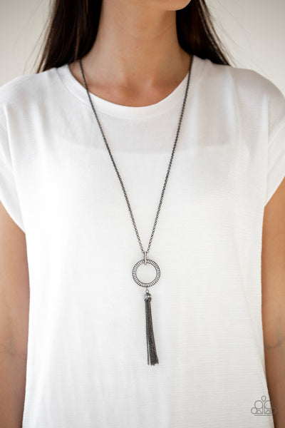 STRAIGHT TO THE TOP - BLACK GUN METAL CIRCLE TASSEL WHITE RHINESTONE PENDANT NECKLACE - PAPARAZZI